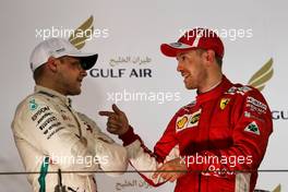 (L to R): Valtteri Bottas (FIN) Mercedes AMG F1 on the podium with race winner Sebastian Vettel (GER) Ferrari. 08.04.2018. Formula 1 World Championship, Rd 2, Bahrain Grand Prix, Sakhir, Bahrain, Race Day.