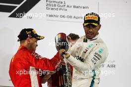 Lewis Hamilton (GBR) Mercedes AMG F1 celebrates his third position on the podium. 08.04.2018. Formula 1 World Championship, Rd 2, Bahrain Grand Prix, Sakhir, Bahrain, Race Day.