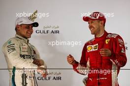 (L to R): Valtteri Bottas (FIN) Mercedes AMG F1 on the podium with race winner Sebastian Vettel (GER) Ferrari. 08.04.2018. Formula 1 World Championship, Rd 2, Bahrain Grand Prix, Sakhir, Bahrain, Race Day.