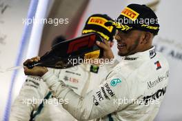 Lewis Hamilton (GBR) Mercedes AMG F1 celebrates his third position on the podium. 08.04.2018. Formula 1 World Championship, Rd 2, Bahrain Grand Prix, Sakhir, Bahrain, Race Day.