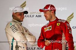 (L to R): Valtteri Bottas (FIN) Mercedes AMG F1 on the podium with race winner Sebastian Vettel (GER) Ferrari. 08.04.2018. Formula 1 World Championship, Rd 2, Bahrain Grand Prix, Sakhir, Bahrain, Race Day.