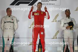 1st place Sebastian Vettel (GER) Ferrari SF71H, 2nd Valtteri Bottas (FIN) Mercedes AMG F1 and 3rd place Lewis Hamilton (GBR) Mercedes AMG F1 W09. 08.04.2018. Formula 1 World Championship, Rd 2, Bahrain Grand Prix, Sakhir, Bahrain, Race Day.