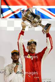 Race winner Sebastian Vettel (GER) Ferrari celebrates on the podium. 08.04.2018. Formula 1 World Championship, Rd 2, Bahrain Grand Prix, Sakhir, Bahrain, Race Day.