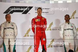 The podium (L to R): Valtteri Bottas (FIN) Mercedes AMG F1, second; Sebastian Vettel (GER) Ferrari, race winner; Lewis Hamilton (GBR) Mercedes AMG F1, third. 08.04.2018. Formula 1 World Championship, Rd 2, Bahrain Grand Prix, Sakhir, Bahrain, Race Day.