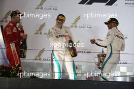 1st place Sebastian Vettel (GER) Ferrari SF71H, 2nd Valtteri Bottas (FIN) Mercedes AMG F1 and 3rd place Lewis Hamilton (GBR) Mercedes AMG F1 W09. 08.04.2018. Formula 1 World Championship, Rd 2, Bahrain Grand Prix, Sakhir, Bahrain, Race Day.