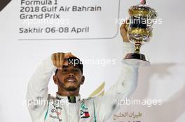 Lewis Hamilton (GBR) Mercedes AMG F1 celebrates his third position on the podium. 08.04.2018. Formula 1 World Championship, Rd 2, Bahrain Grand Prix, Sakhir, Bahrain, Race Day.