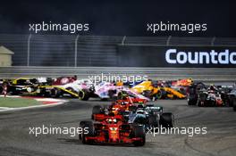 Sebastian Vettel (GER) Ferrari SF71H leads at the start of the race. 08.04.2018. Formula 1 World Championship, Rd 2, Bahrain Grand Prix, Sakhir, Bahrain, Race Day.