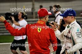 (L to R): Sebastian Vettel (GER) Ferrari with Valtteri Bottas (FIN) Mercedes AMG F1 in qualifying parc ferme. 07.04.2018. Formula 1 World Championship, Rd 2, Bahrain Grand Prix, Sakhir, Bahrain, Qualifying Day.