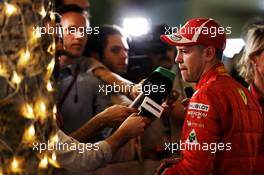 Sebastian Vettel (GER) Ferrari with the media. 07.04.2018. Formula 1 World Championship, Rd 2, Bahrain Grand Prix, Sakhir, Bahrain, Qualifying Day.