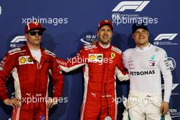 Qualifying top three in parc ferme (L to R): Kimi Raikkonen (FIN) Ferrari, second; Sebastian Vettel (GER) Ferrari, pole position; Valtteri Bottas (FIN) Mercedes AMG F1, third. 07.04.2018. Formula 1 World Championship, Rd 2, Bahrain Grand Prix, Sakhir, Bahrain, Qualifying Day.