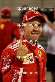 Sebastian Vettel (GER) Ferrari celebrates his pole position in qualifying parc ferme. 07.04.2018. Formula 1 World Championship, Rd 2, Bahrain Grand Prix, Sakhir, Bahrain, Qualifying Day.