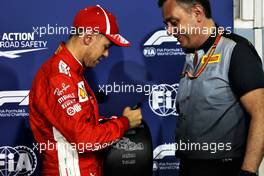 Sebastian Vettel (GER) Ferrari celebrates his pole position with Mario Isola (ITA) Pirelli Racing Manager. 07.04.2018. Formula 1 World Championship, Rd 2, Bahrain Grand Prix, Sakhir, Bahrain, Qualifying Day.