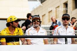 (L to R): Carlos Sainz Jr (ESP) Renault Sport F1 Team with Fernando Alonso (ESP) McLaren and Stoffel Vandoorne (BEL) McLaren on the drivers parade. 08.04.2018. Formula 1 World Championship, Rd 2, Bahrain Grand Prix, Sakhir, Bahrain, Race Day.