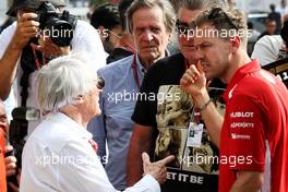 (L to R): Bernie Ecclestone (GBR) with Sebastian Vettel (GER) Ferrari. 08.04.2018. Formula 1 World Championship, Rd 2, Bahrain Grand Prix, Sakhir, Bahrain, Race Day.
