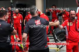 Haas F1 Team members watch Ferrari practice pit stops. 05.04.2018. Formula 1 World Championship, Rd 2, Bahrain Grand Prix, Sakhir, Bahrain, Preparation Day.