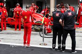 Haas F1 Team members watch Ferrari practice pit stops. 05.04.2018. Formula 1 World Championship, Rd 2, Bahrain Grand Prix, Sakhir, Bahrain, Preparation Day.