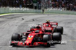 Sebastian Vettel (GER) Ferrari SF71H and Kimi Raikkonen (FIN) Ferrari SF71H on the grid. 11.11.2018. Formula 1 World Championship, Rd 20, Brazilian Grand Prix, Sao Paulo, Brazil, Race Day.