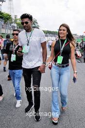 Leandrinho (BRA) basketball player with his girlfriend Talita Rocca (BRA) on the grid. 11.11.2018. Formula 1 World Championship, Rd 20, Brazilian Grand Prix, Sao Paulo, Brazil, Race Day.