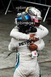 Race winner Lewis Hamilton (GBR) Mercedes AMG F1 celebrates with team mate Valtteri Bottas (FIN) Mercedes AMG F1 in parc ferme. 11.11.2018. Formula 1 World Championship, Rd 20, Brazilian Grand Prix, Sao Paulo, Brazil, Race Day.
