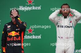 Max Verstappen (NLD) Red Bull Racing RB14 and 1st place Lewis Hamilton (GBR) Mercedes AMG F1 W09. 11.11.2018. Formula 1 World Championship, Rd 20, Brazilian Grand Prix, Sao Paulo, Brazil, Race Day.