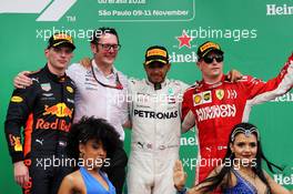 The podium (L to R): Max Verstappen (NLD) Red Bull Racing, second; Andrew Shovlin (GBR) Mercedes AMG F1 Engineer; Lewis Hamilton (GBR) Mercedes AMG F1, race winner; Kimi Raikkonen (FIN) Ferrari, third. 11.11.2018. Formula 1 World Championship, Rd 20, Brazilian Grand Prix, Sao Paulo, Brazil, Race Day.