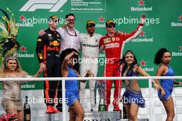 The podium (L to R): Max Verstappen (NLD) Red Bull Racing, second; Andrew Shovlin (GBR) Mercedes AMG F1 Engineer; Lewis Hamilton (GBR) Mercedes AMG F1, race winner; Kimi Raikkonen (FIN) Ferrari, third. 11.11.2018. Formula 1 World Championship, Rd 20, Brazilian Grand Prix, Sao Paulo, Brazil, Race Day.