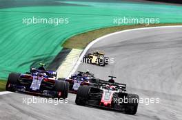 Romain Grosjean (FRA) Haas F1 Team VF-18 and Pierre Gasly (FRA) Scuderia Toro Rosso STR13 battle for position. 11.11.2018. Formula 1 World Championship, Rd 20, Brazilian Grand Prix, Sao Paulo, Brazil, Race Day.