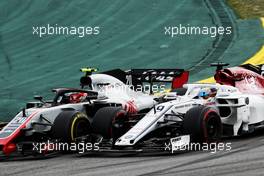 Kevin Magnussen (DEN) Haas VF-18 and Marcus Ericsson (SWE) Sauber C37 battle for position. 11.11.2018. Formula 1 World Championship, Rd 20, Brazilian Grand Prix, Sao Paulo, Brazil, Race Day.