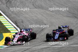 Sergio Perez (MEX) Racing Point Force India F1 VJM11 and Pierre Gasly (FRA) Scuderia Toro Rosso STR13 battle for position. 11.11.2018. Formula 1 World Championship, Rd 20, Brazilian Grand Prix, Sao Paulo, Brazil, Race Day.