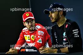 (L to R): Sebastian Vettel (GER) Ferrari with Lewis Hamilton (GBR) Mercedes AMG F1 in the post qualifying FIA Press Conference. 10.11.2018. Formula 1 World Championship, Rd 20, Brazilian Grand Prix, Sao Paulo, Brazil, Qualifying Day.