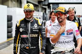 (L to R): Carlos Sainz Jr (ESP) Renault Sport F1 Team with Fernando Alonso (ESP) McLaren. 10.11.2018. Formula 1 World Championship, Rd 20, Brazilian Grand Prix, Sao Paulo, Brazil, Qualifying Day.