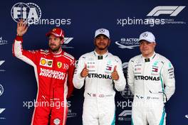 Qualifying top three in parc ferme (L to R): Sebastian Vettel (GER) Ferrari, second; Lewis Hamilton (GBR) Mercedes AMG F1, pole position; Valtteri Bottas (FIN) Mercedes AMG F1, third. 10.11.2018. Formula 1 World Championship, Rd 20, Brazilian Grand Prix, Sao Paulo, Brazil, Qualifying Day.