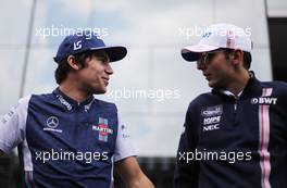 Lance Stroll (CDN) Williams F1 Team and Esteban Ocon (FRA) Force India F1  11.11.2018. Formula 1 World Championship, Rd 20, Brazilian Grand Prix, Sao Paulo, Brazil, Race Day.