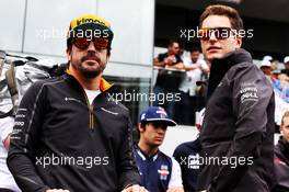 (L to R): Fernando Alonso (ESP) McLaren and Stoffel Vandoorne (BEL) McLaren on the drivers parade. 11.11.2018. Formula 1 World Championship, Rd 20, Brazilian Grand Prix, Sao Paulo, Brazil, Race Day.