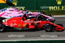 Sebastian Vettel (GER) Ferrari SF71H and Esteban Ocon (FRA) Sahara Force India F1 VJM11. 08.06.2018. Formula 1 World Championship, Rd 7, Canadian Grand Prix, Montreal, Canada, Practice Day.