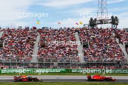 Kimi Raikkonen (FIN) Ferrari SF71H leads Daniel Ricciardo (AUS) Red Bull Racing RB14. 10.06.2018. Formula 1 World Championship, Rd 7, Canadian Grand Prix, Montreal, Canada, Race Day.