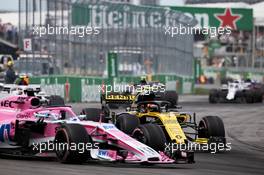 Sergio Perez (MEX) Sahara Force India F1 VJM11 and Carlos Sainz Jr (ESP) Renault Sport F1 Team RS18 make contact. 10.06.2018. Formula 1 World Championship, Rd 7, Canadian Grand Prix, Montreal, Canada, Race Day.