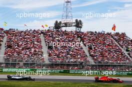 Sebastian Vettel (GER) Ferrari SF71H leads Valtteri Bottas (FIN) Mercedes AMG F1 W09. 10.06.2018. Formula 1 World Championship, Rd 7, Canadian Grand Prix, Montreal, Canada, Race Day.