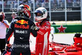 Sebastian Vettel (GER) Ferrari (Right) celebrates his pole position with third placed Max Verstappen (NLD) Red Bull Racing in qualifying parc ferme. 09.06.2018. Formula 1 World Championship, Rd 7, Canadian Grand Prix, Montreal, Canada, Qualifying Day.
