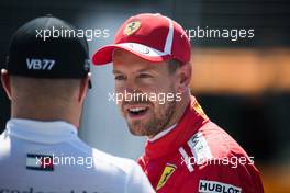 (L to R): Valtteri Bottas (FIN) Mercedes AMG F1 with Sebastian Vettel (GER) Ferrari in qualifying parc ferme. 09.06.2018. Formula 1 World Championship, Rd 7, Canadian Grand Prix, Montreal, Canada, Qualifying Day.