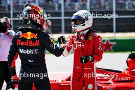 Sebastian Vettel (GER) Ferrari (Right) celebrates his pole position with third placed Max Verstappen (NLD) Red Bull Racing in qualifying parc ferme. 09.06.2018. Formula 1 World Championship, Rd 7, Canadian Grand Prix, Montreal, Canada, Qualifying Day.