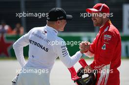 Valtteri Bottas (FIN) Mercedes AMG F1 and Sebastian Vettel (GER) Ferrari SF71H. 09.06.2018. Formula 1 World Championship, Rd 7, Canadian Grand Prix, Montreal, Canada, Qualifying Day.
