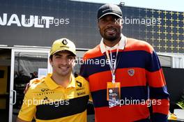 Carlos Sainz Jr (ESP) Renault Sport F1 Team with Serge Ibaka (COG) NBA Basketball Player. 10.06.2018. Formula 1 World Championship, Rd 7, Canadian Grand Prix, Montreal, Canada, Race Day.