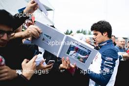 Lance Stroll (CDN) Williams signs autographs for the fans. 07.06.2018. Formula 1 World Championship, Rd 7, Canadian Grand Prix, Montreal, Canada, Preparation Day.