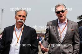 (L to R): Chase Carey (USA) Formula One Group Chairman with Sean Bratches (USA) Formula 1 Managing Director, Commercial Operations. 15.04.2018. Formula 1 World Championship, Rd 3, Chinese Grand Prix, Shanghai, China, Race Day.