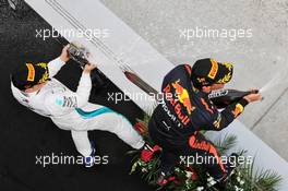 Race winner Daniel Ricciardo (AUS) Red Bull Racing celebrates on the podium with second placed Valtteri Bottas (FIN) Mercedes AMG F1. 15.04.2018. Formula 1 World Championship, Rd 3, Chinese Grand Prix, Shanghai, China, Race Day.