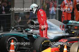 Sebastian Vettel (GER) Ferrari SF71H looking at Lewis Hamilton's car. 15.04.2018. Formula 1 World Championship, Rd 3, Chinese Grand Prix, Shanghai, China, Race Day.