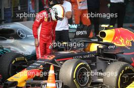 Sebastian Vettel (GER) Ferrari SF71H looking at Max Verstappen's car. 15.04.2018. Formula 1 World Championship, Rd 3, Chinese Grand Prix, Shanghai, China, Race Day.
