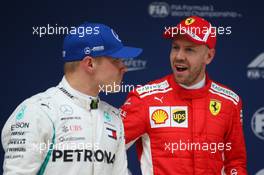 Valtteri Bottas (FIN) Mercedes AMG F1 and Sebastian Vettel (GER) Ferrari SF71H. 14.04.2018. Formula 1 World Championship, Rd 3, Chinese Grand Prix, Shanghai, China, Qualifying Day.