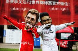 Sebastian Vettel (GER) Ferrari and Lewis Hamilton (GBR) Mercedes AMG F1 caricatures. 14.04.2018. Formula 1 World Championship, Rd 3, Chinese Grand Prix, Shanghai, China, Qualifying Day.